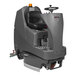 A NaceCare Solutions cordless ride-on floor scrubber with a black seat and wheels.