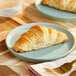 A plate of ready-to-bake vegan straight croissants.