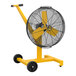 A yellow Big Ass Fans AirEye on a stand with wheels.
