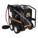 A black Mi-T-M hot water pressure washer with wheels and a hose attached.
