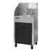 An Ozark River stainless steel portable hot water hand sink on wheels with black cabinets.