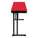 A red rectangular National Public Seating folding table with black legs and a black border.