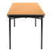 A National Public Seating Fusion Maple rectangular table with black legs.