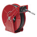 A red and black Reelcraft hose reel with a hose attached.