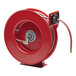 A red Reelcraft hose reel with a hose attached.