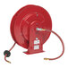 A red Reelcraft hose reel with a hose attached to it.