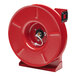 A red metal Reelcraft hose reel with a hose attached.