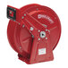 A red Reelcraft hose reel with a black handle.