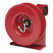 A red Reelcraft hose reel with a silver hose connected to it.