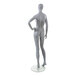 An Econoco female mannequin with an oval head, left hand on hip, and bent right leg.