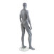 A full shot of a male mannequin with a slate gray finish, arms at its sides, and its right leg bent.