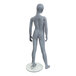 An Econoco slate 8-year-old unisex mannequin with a grey body standing on a glass stand.