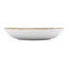 A white china bowl with a gold rim.