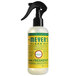 A Mrs. Meyer's Clean Day Honeysuckle Air Freshener Deodorizer spray bottle with a black sprayer.