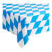 A Table Mate Bavarian Diamonds blue and white checkered plastic table cover on a table.