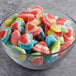 A bowl of Vidal assorted color gummy triple hearts.
