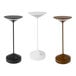 Three Abert Tempo charcoal table lamps with white poles on a table.