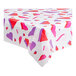 A white plastic Table Mate table cover with red and purple hearts on a table.