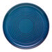 A Libbey Canyonlands blue stoneware plate with a spiral pattern.