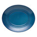 A blue oval terracotta platter with red lines on it.