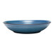 A close-up of a blue Libbey Canyonlands terracotta coupe bowl with a brown rim.