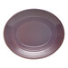 A mauve oval terracotta platter with a stripe design on the edge.