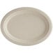 A white oval World Centric compostable fiber plate with a round edge.
