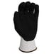 A black glove with a white palm and white cuff.