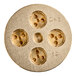 A circular brass Bucatini pasta die with holes in it.