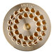 A gold plated circular metal pasta die with holes in it.