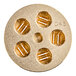 A circular gold pasta die with holes in it.