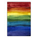 A Joy Carpets rainbow area rug with a white border and rainbow pattern.