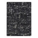 A close-up of a black and white Joy Carpets rectangle area rug with a distressed look.