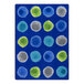 A white area rug with blue, green, and grey circles.