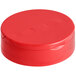 A red plastic dual-flapper spice lid with induction liner.