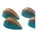 A group of blue and brown Pavoni Praline chocolates made using a Pavoni Praline candy mold.