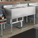 A white Regency underbar sink with three compartments and a right drainboard.