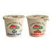 Two Pequea Valley Farm yogurt containers with lids, one with blueberries and one with strawberries.