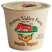 A white Pequea Valley Farm peach yogurt container with a label.