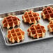 A white tray with six White Toque small Liege waffles.