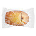 A white Toque bag of individually wrapped chocolate hazelnut filled madeleines.