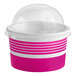 A pink and white paper frozen yogurt container with a clear dome lid.