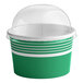 A green and white container with a clear dome lid.