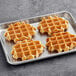 White Toque Heritage Liege Margarine Waffles baking on a tray.