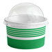 A green and white paper frozen yogurt container with a clear dome lid.