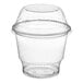 A Choice clear plastic dessert cup with a low dome lid.