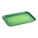 A green Cambro rectangular tray with a football field design.