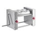 A stainless steel Estella manual turnover machine with red knobs and a handle.