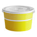 A yellow paper Choice frozen yogurt cup with a flat lid.