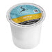 A white plastic container of Caribou Coffee Daybreak Morning Blend Single Serve K-Cup Pods with a blue and yellow label.